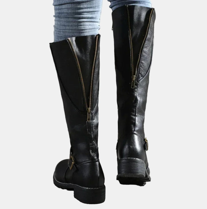 Chic women's tall boots, buckle-strap knee high design with a comfortable low heel for all-day wear.
