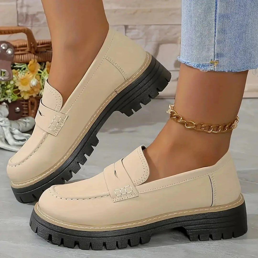 Women's black chunky platform loafers, easy slip-on style. Comfortable & versatile smart casual footwear.