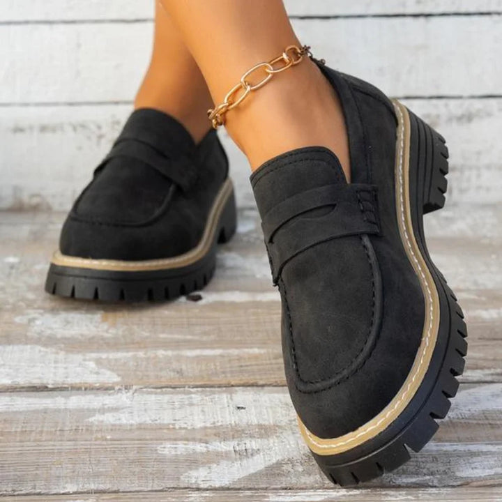 Fashionable women's slip-on chunky platform loafers. Versatile footwear for comfortable smart casual styling.