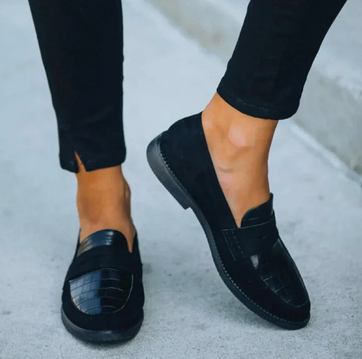 Women's black croc print slip-on loafers for everyday comfort. Stylish and versatile casual flats.