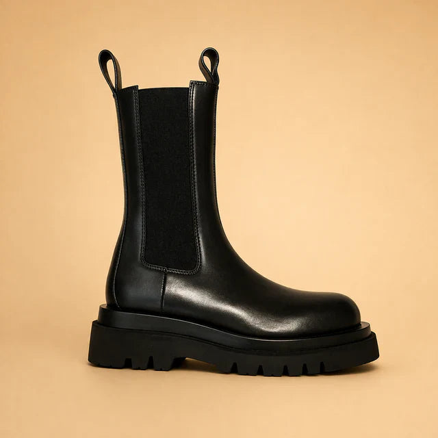 Chic black slip-on ankle boots for women, perfect for adding a touch of elegance.