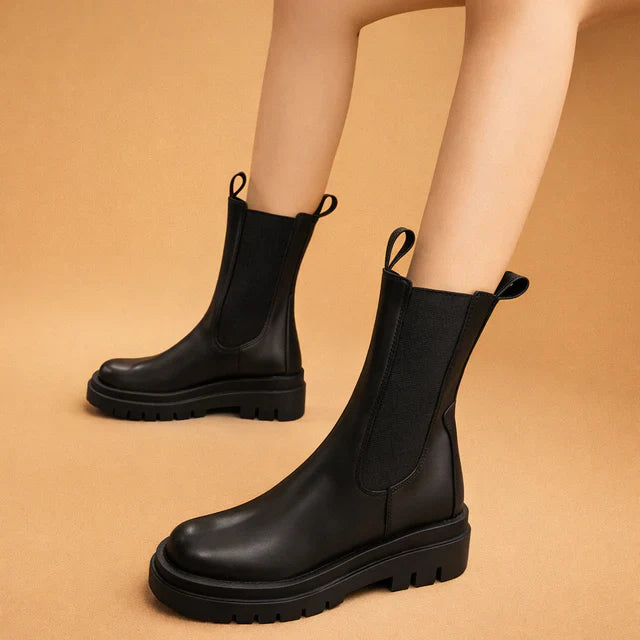 Stylish women's high ankle boots in black, combining fashion and all-day comfort.
