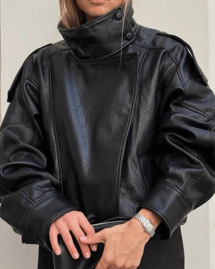 Stylish woman wearing a black high neck leather jacket, perfect for modern fashion outerwear.