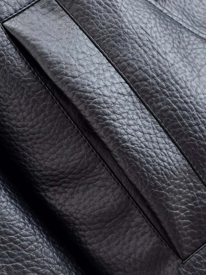 Textured black leather high neck jacket for women, a sleek and modern outerwear piece.
