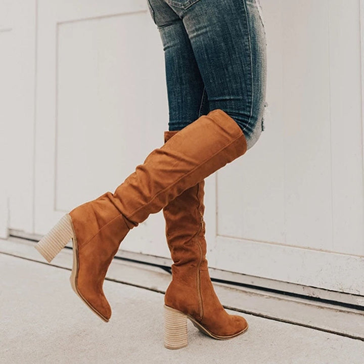 Women's black knee high slouch boots with side zipper, comfortable block heel for fall fashion.