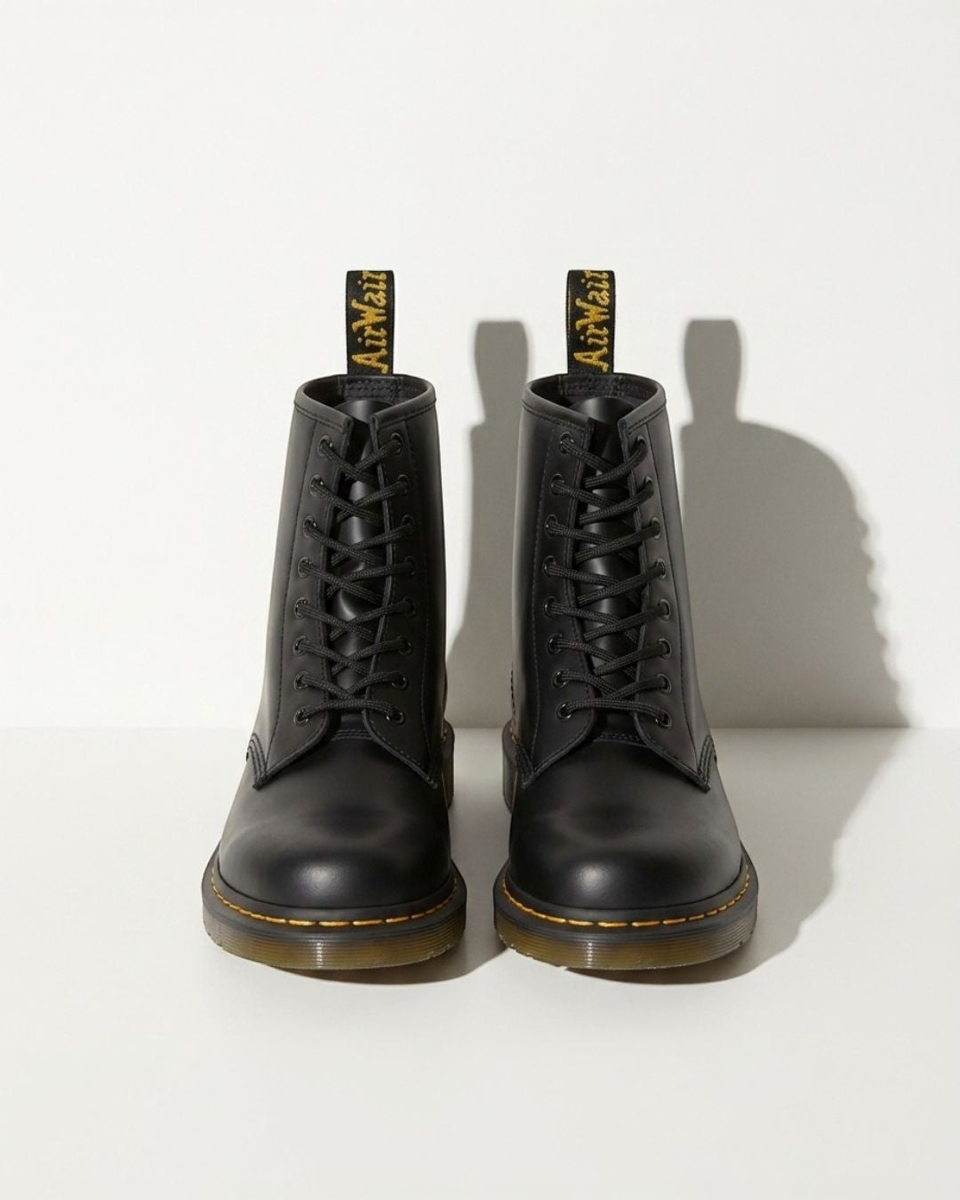Versatile women's black lace-up combat ankle boots with chunky sole, ideal for winter & autumn fashion.