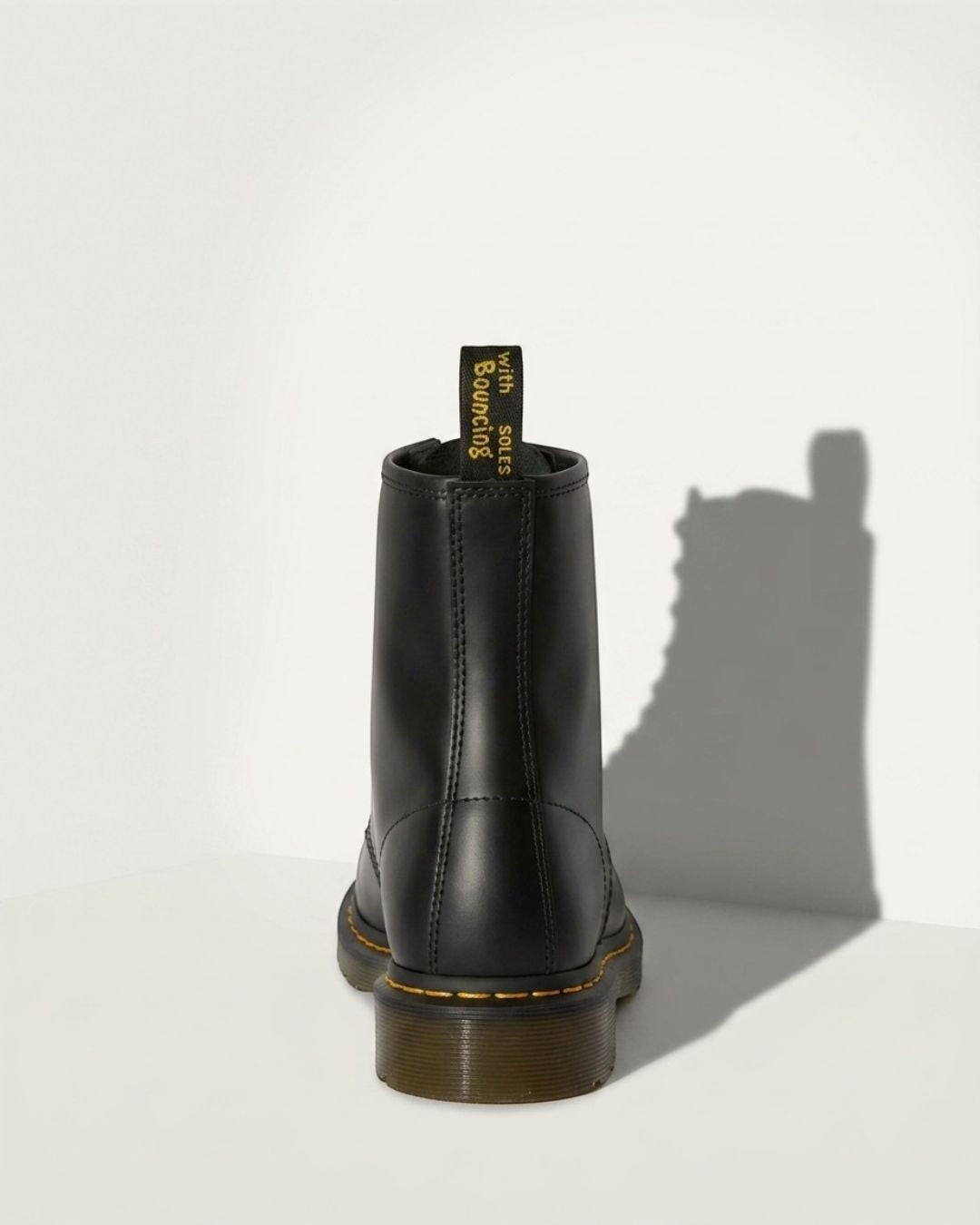 Stylish women's lace-up ankle combat boots in black, featuring a trendy chunky sole for urban fashion.