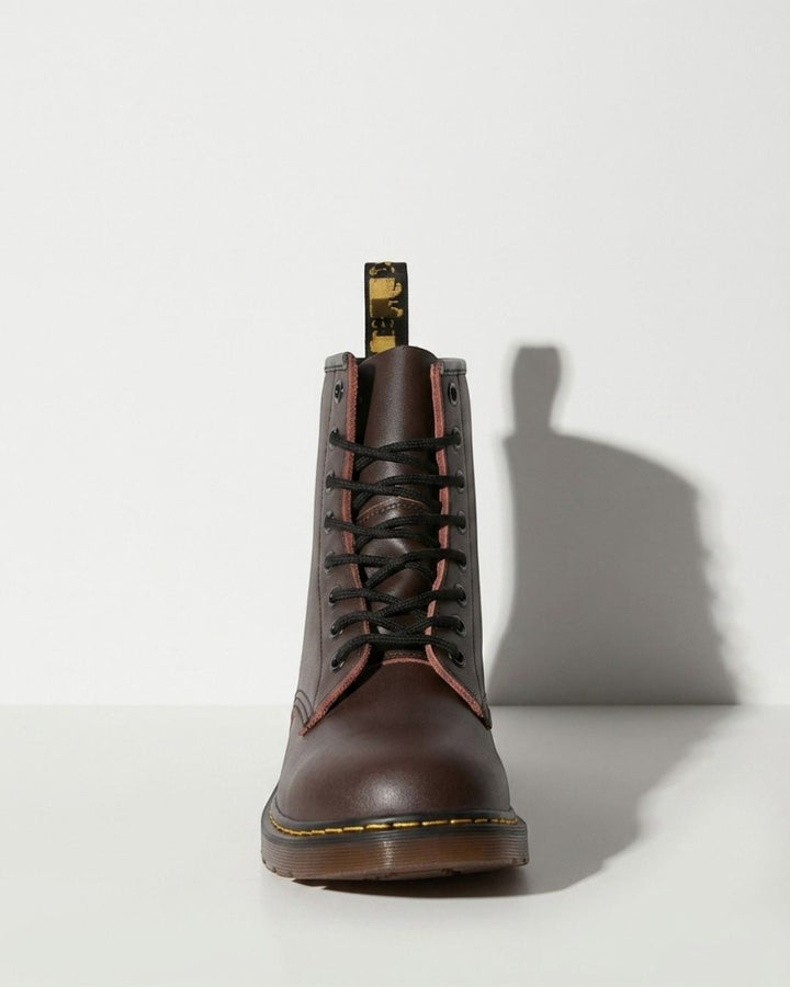 Black women's combat ankle boots, lace-up style with a chunky sole, perfect for edgy urban & winter fashion.