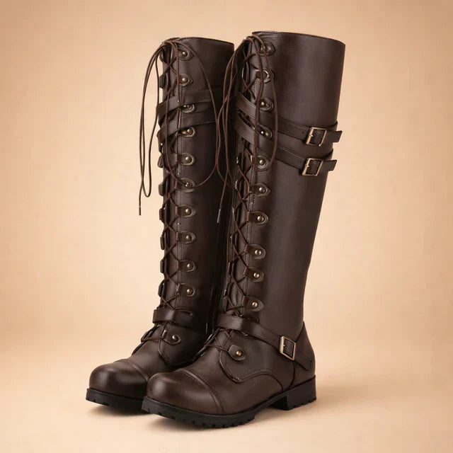Stylish women's fashion boots with a thigh-high silhouette, complete with adjustable laces and silver buckles.