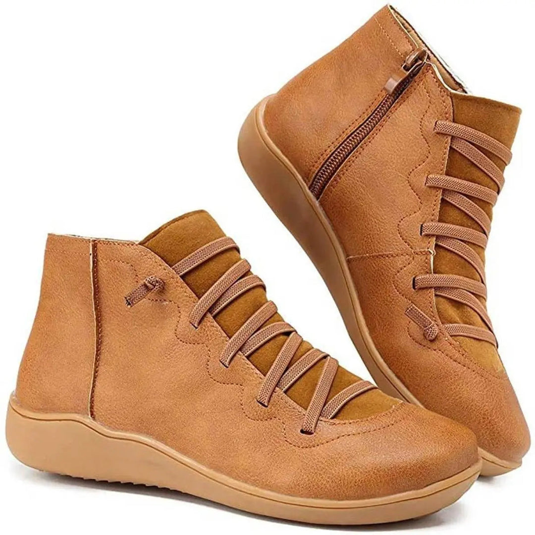 Women's black lace-up side-zip flat ankle boots. Casual style, comfortable autumn/winter footwear.