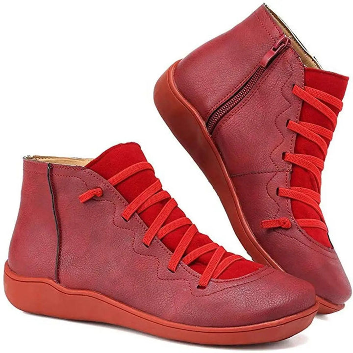 Stylish women's lace-up ankle boots featuring a convenient side zip and comfortable flat heel. Versatile footwear.