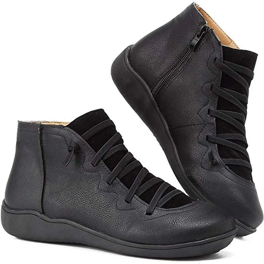 Casual women's flat ankle boots, perfect for autumn & winter. Features lace-up front and practical side zip.