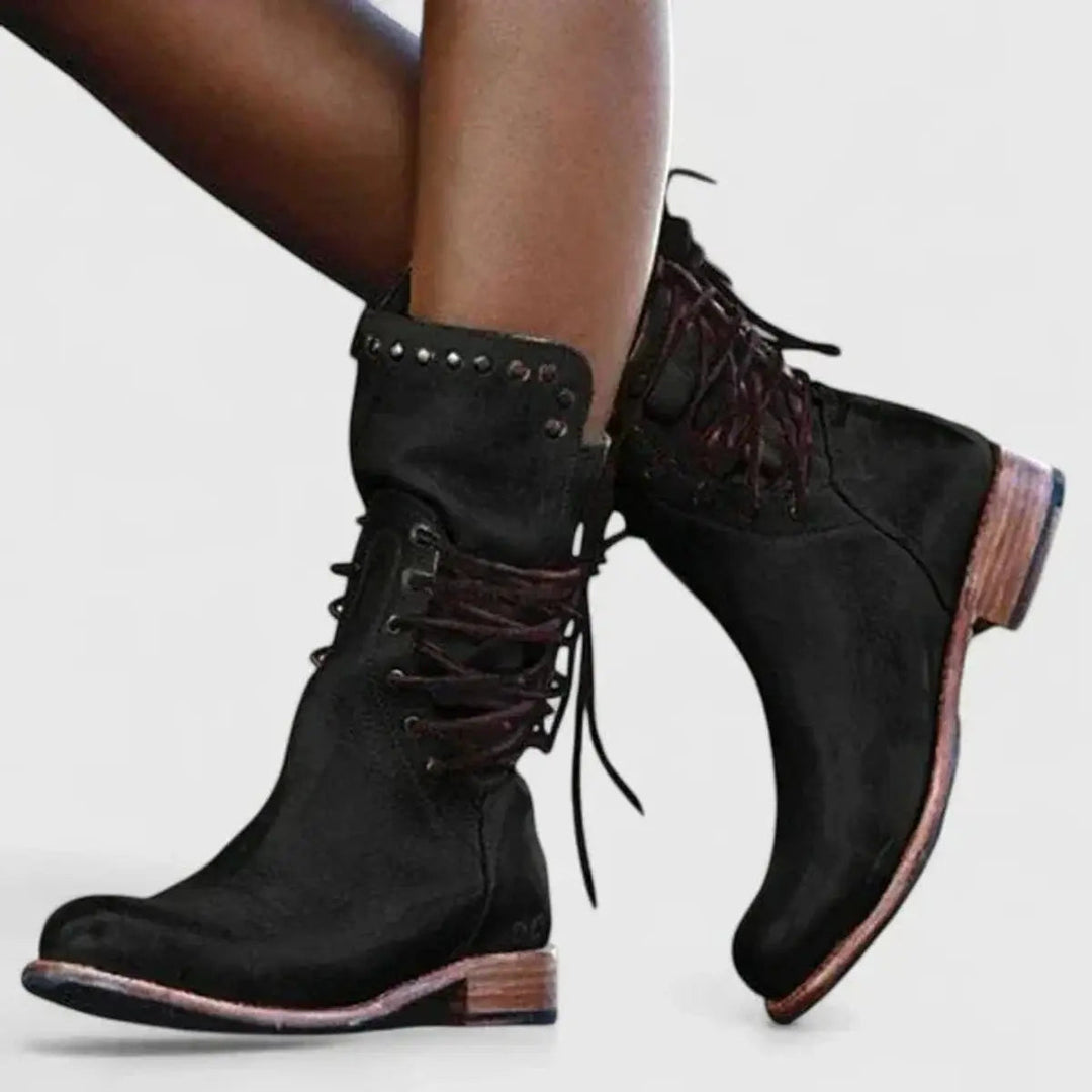 Stylish women's studded lace-up ankle boots with a block heel, offering a rugged, knee-high style look.