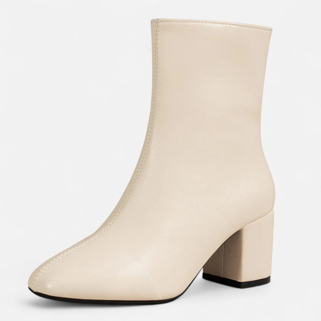 Fashionable women's footwear: leather ankle boots with a sturdy block heel