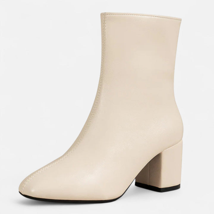 Fashionable women's footwear: leather ankle boots with a sturdy block heel