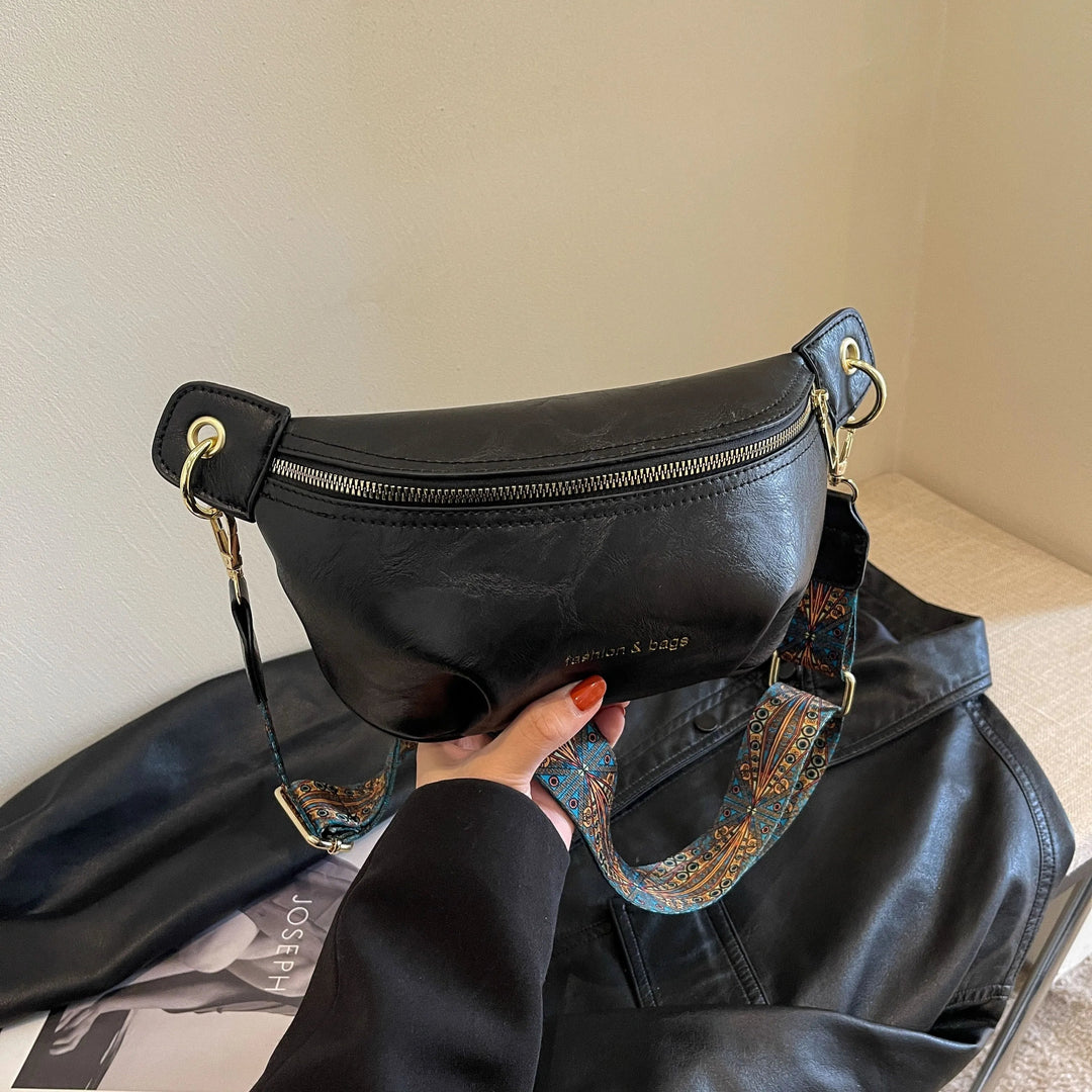 Stylish women's leather belt bag in brown, a chic accessory for everyday carry, can be worn as a hip or waist bag.