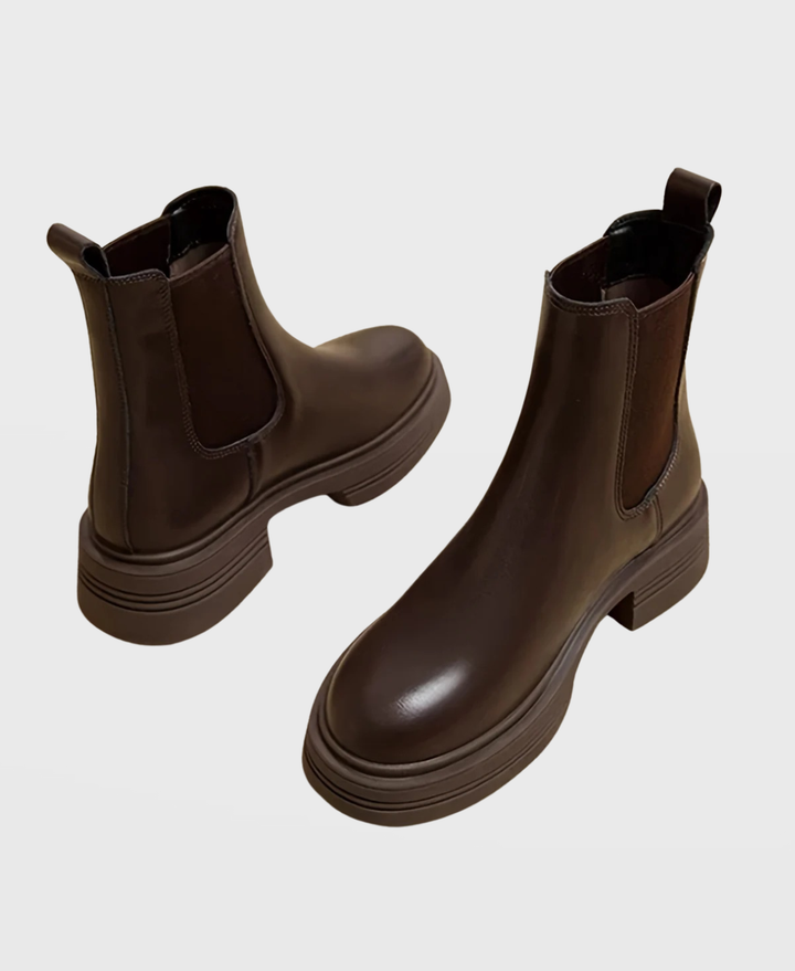 Comfortable women's Chelsea ankle boots with sturdy block heel. Versatile slip-on design, perfect for fall and winter fashion.