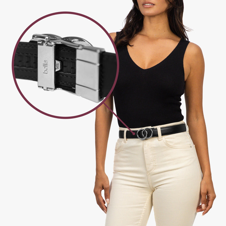 Adjustable black leather women's belt with sleek ratchet buckle, offering a perfect, secure fit for any outfit.
