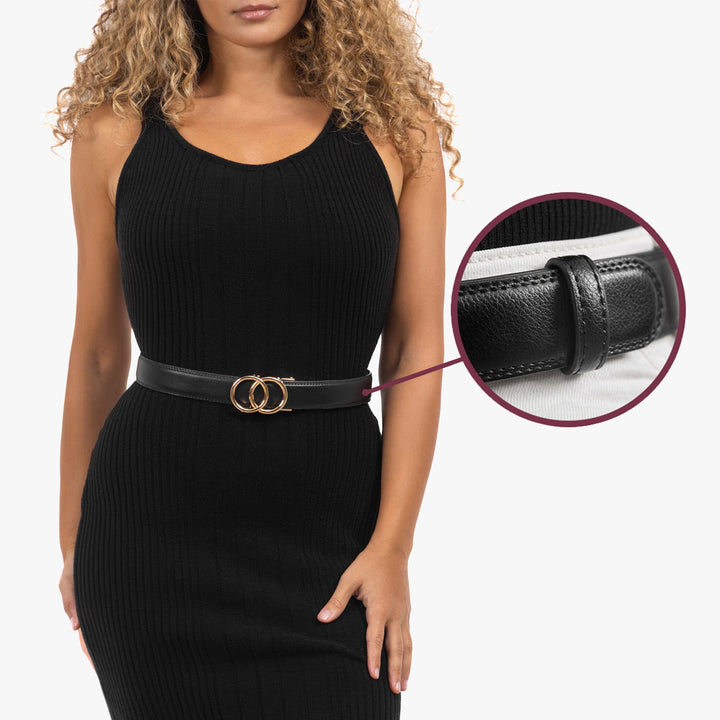 Classic black leather women's belt, an adjustable ratchet design ensuring a flawless and secure fit for trousers.