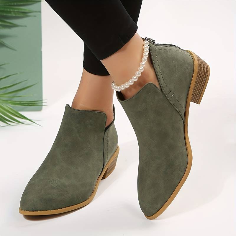 Chic women's pointed toe ankle boots with low block heel. Versatile & stylish footwear for elegant everyday wear.
