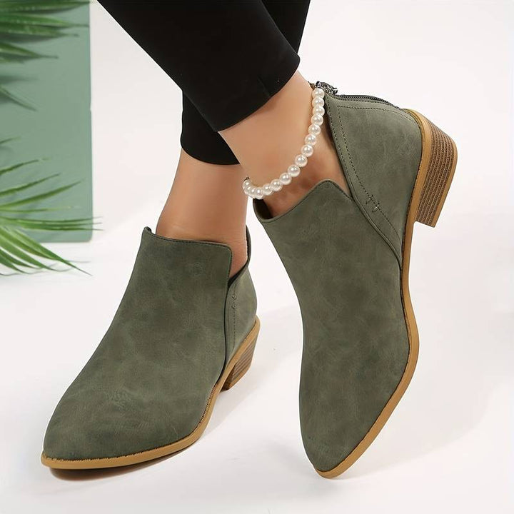 Chic women's pointed toe ankle boots with low block heel. Versatile & stylish footwear for elegant everyday wear.