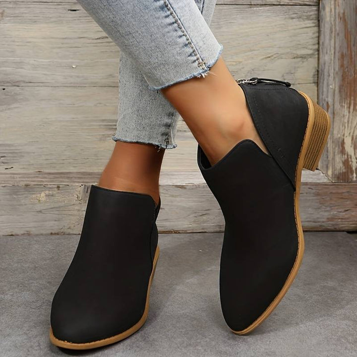 Fashionable women's pointed toe ankle boots with a low, sturdy block heel. Elegant and comfortable women's booties.