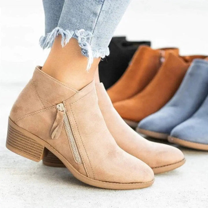 Chic women's low-heel zip-up ankle boots. Versatile block heel design, perfect for fall and winter everyday fashion.