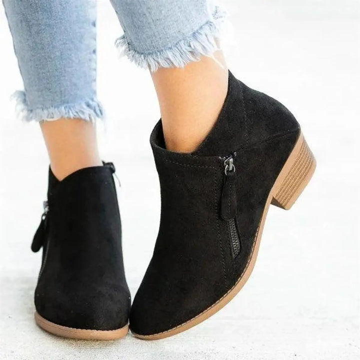 Women's casual low-heel zip-up ankle boots. Chic, comfortable footwear for versatile everyday fall fashion.