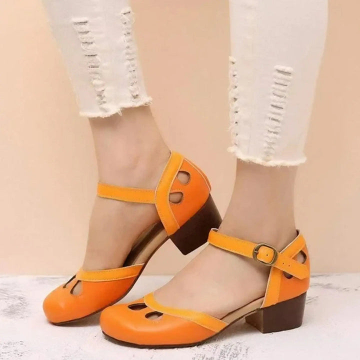 Vintage style women's Mary Jane flats with chic ankle strap, elegant cutout detail, perfect for fashion wear.