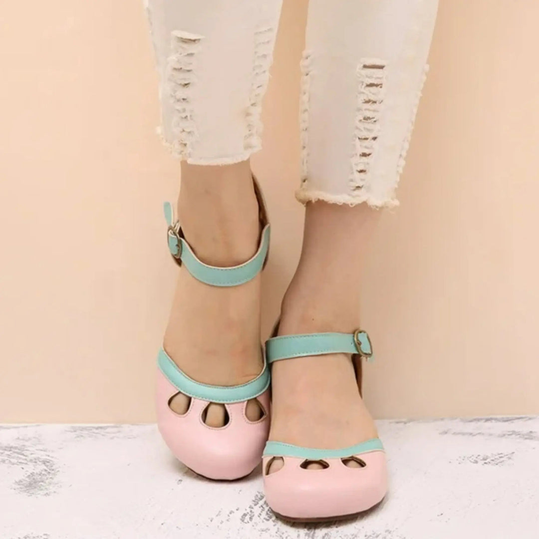 Stylish casual women's Mary Jane flats with a secure ankle strap and delicate cutout patterns, ideal for daily wear.