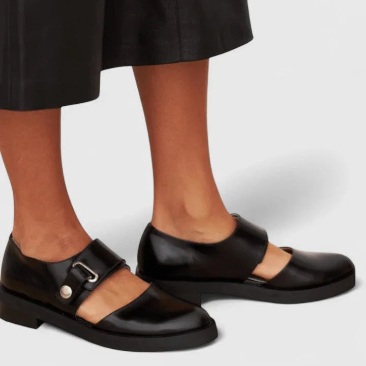 Elegant black Mary-Jane flats for women, featuring chic side cut-outs. Ideal for office, casual, or everyday wear.