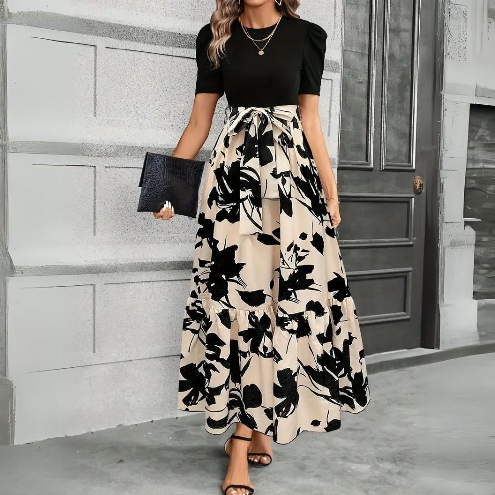 Women's black maxi sundress with an elegant botanical print, ideal for summer, vacation, or casual wear.