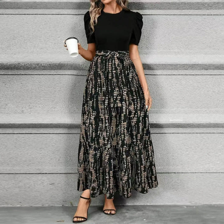 Elegant women's printed maxi sundress featuring a vibrant botanical and floral design for summer.