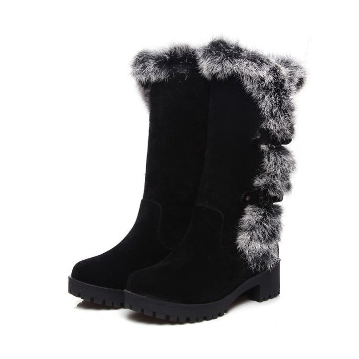Chic women's faux fur trim winter boots. Mid-calf design with buckle accents, ideal for snowy days.