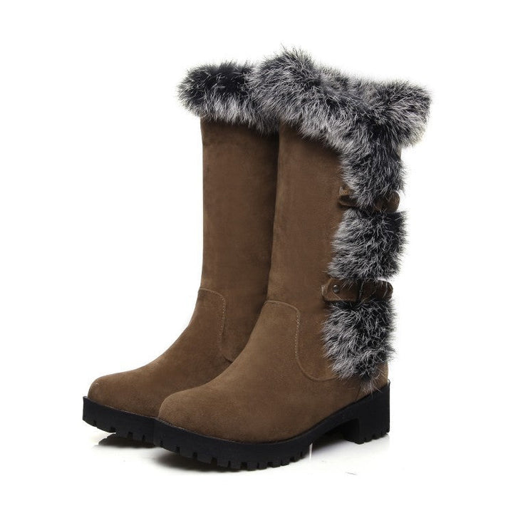 Fashionable women's mid-calf buckle boots, featuring soft faux fur trim for a cozy and stylish winter look.