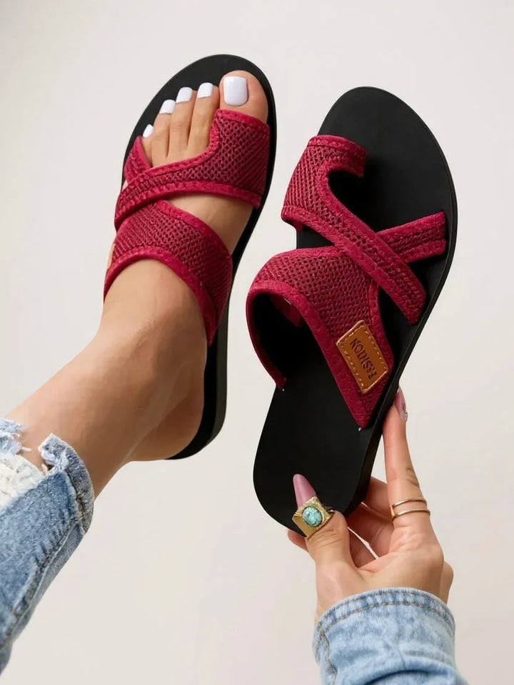 Cushioned women's black slides, open-toe design with a toe loop for secure, breathable casual summer footwear.