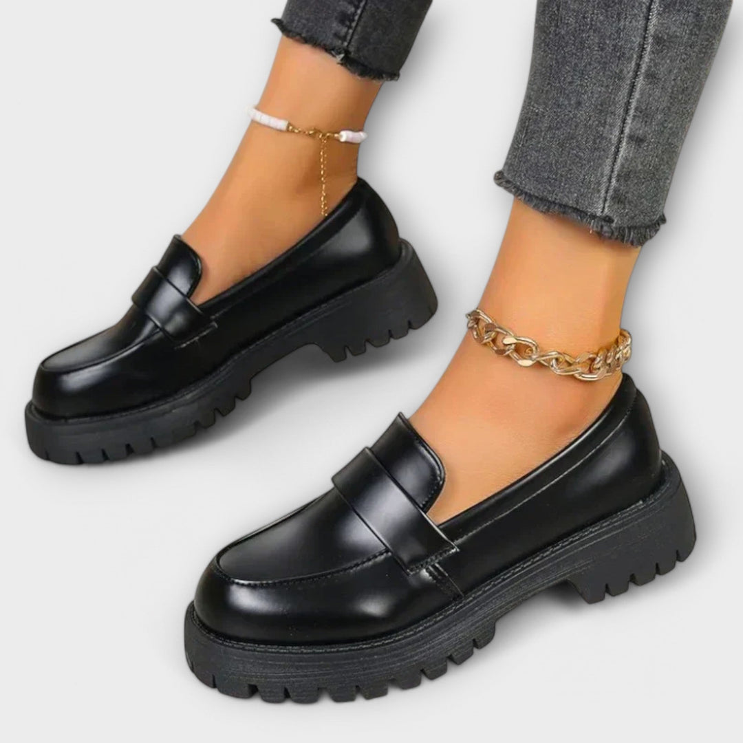 Women's black orthopaedic loafers for everyday comfort & foot support. Elegant slip-on design for casual or dressy wear.