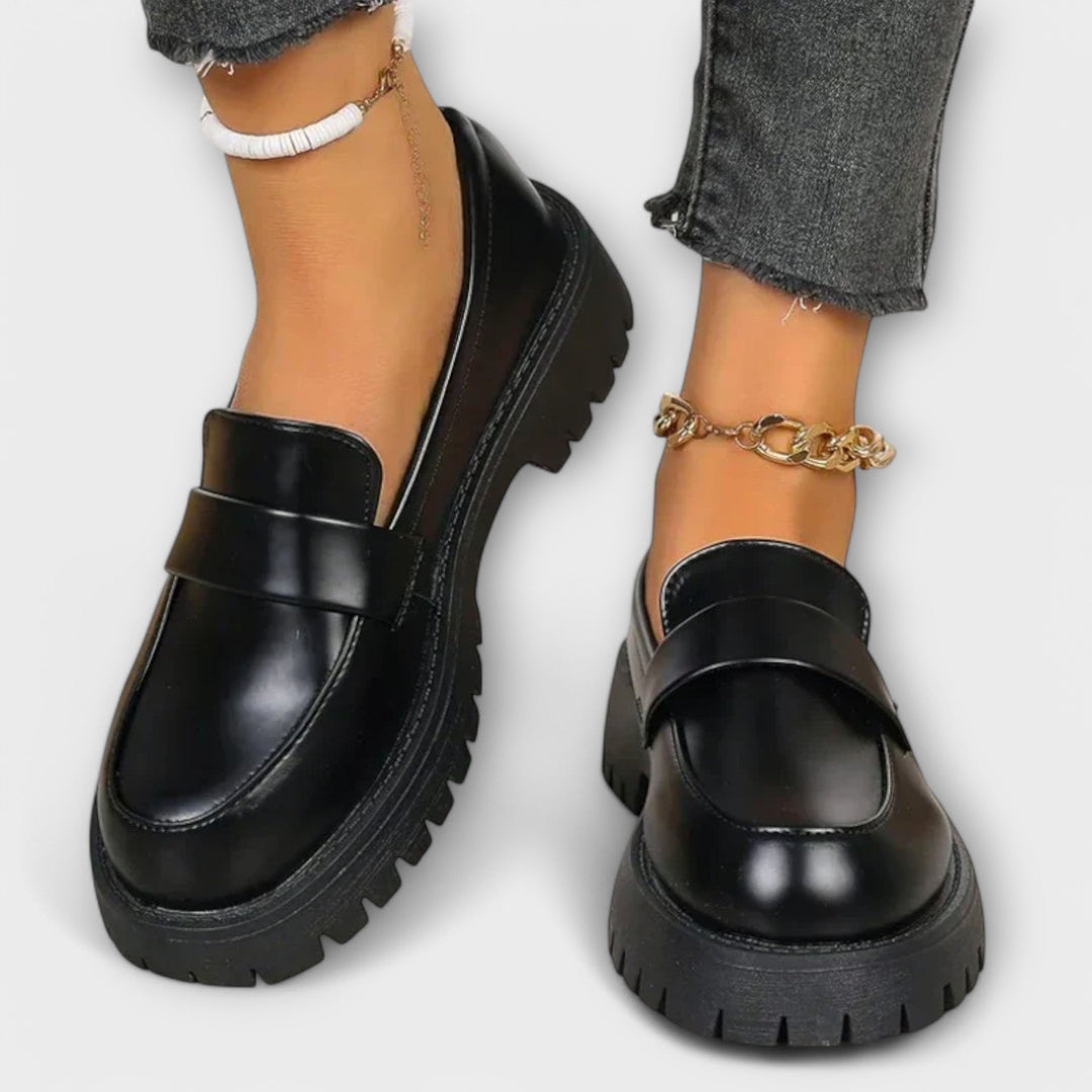 Elegant women's black slip-on loafers, perfect for casual or dressy outfits. Offers orthopaedic comfort & support.