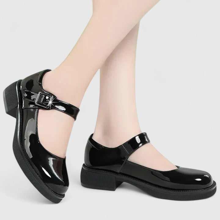 Black flat orthopedic walking shoes for women, superior comfort & arch support for daily activities.