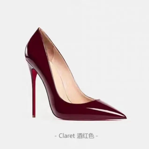 Classic black patent leather high heels with a sharp pointed toe design.