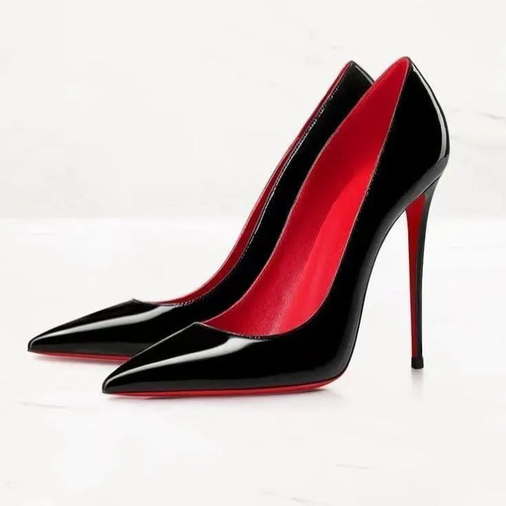Stylish women's fashion footwear: patent finish pointed toe stiletto heels.