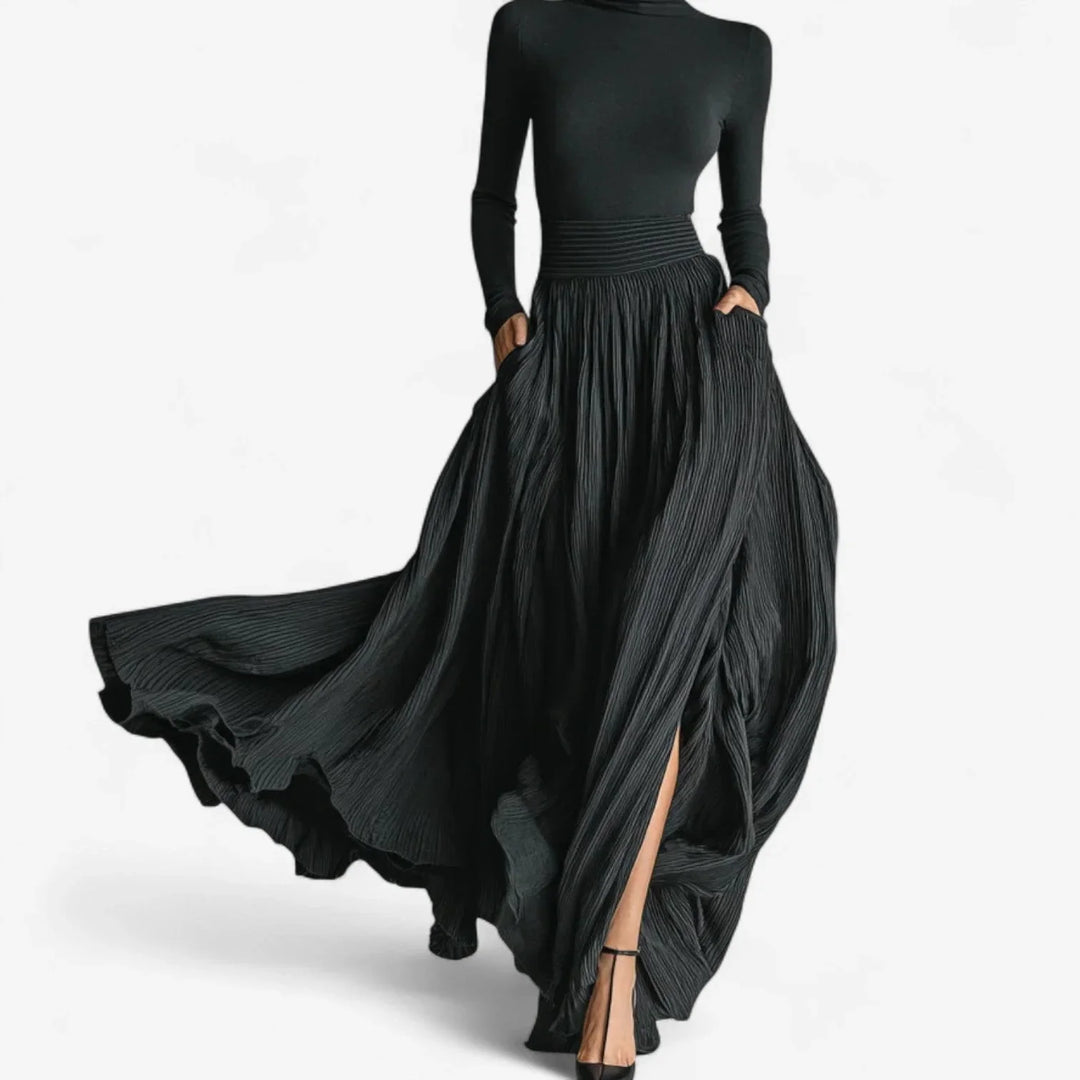 Women's black pleated maxi dress with turtleneck and long sleeves, perfect for elegant evening wear.