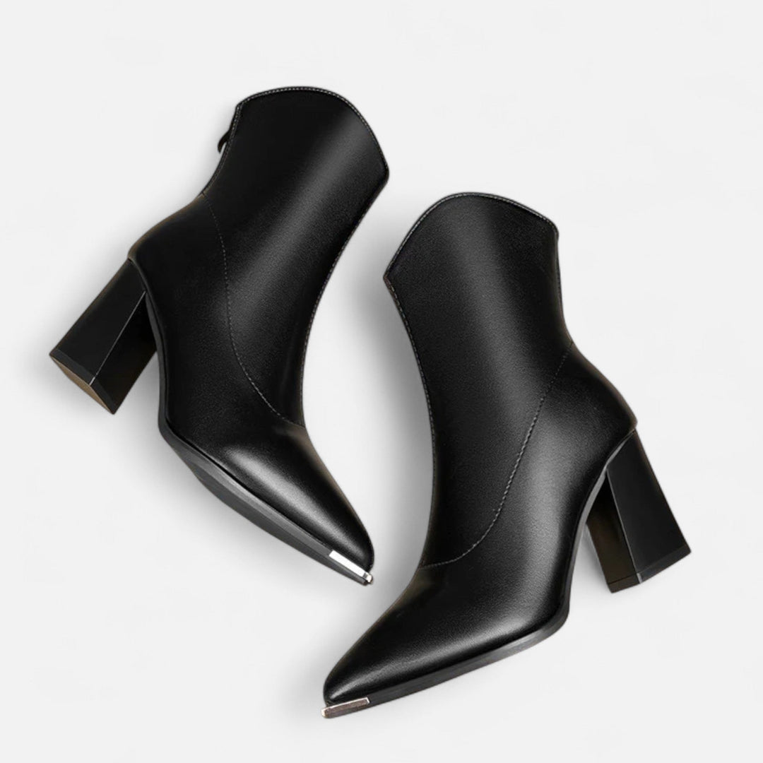 Versatile women's pointed-toe Chelsea boots. Easily styled for casual or dressy outfits. Slip-on elegant footwear.