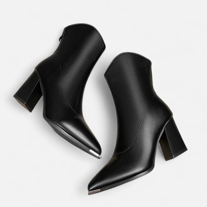 Versatile women's pointed-toe Chelsea boots. Easily styled for casual or dressy outfits. Slip-on elegant footwear.