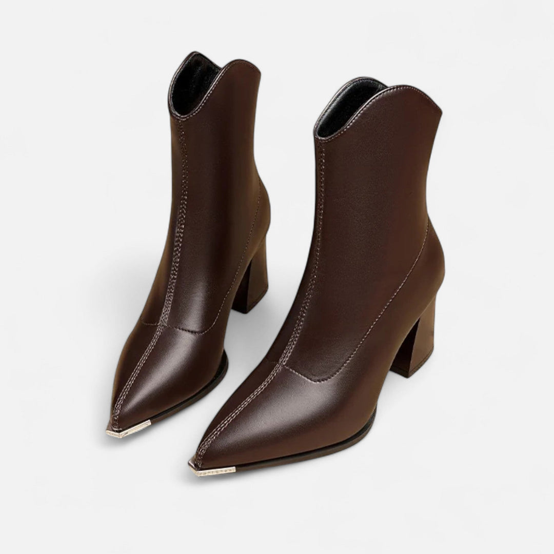 Stylish women's pointed-toe Chelsea boots with elastic side panels. Elegant ankle boots for modern wardrobes.