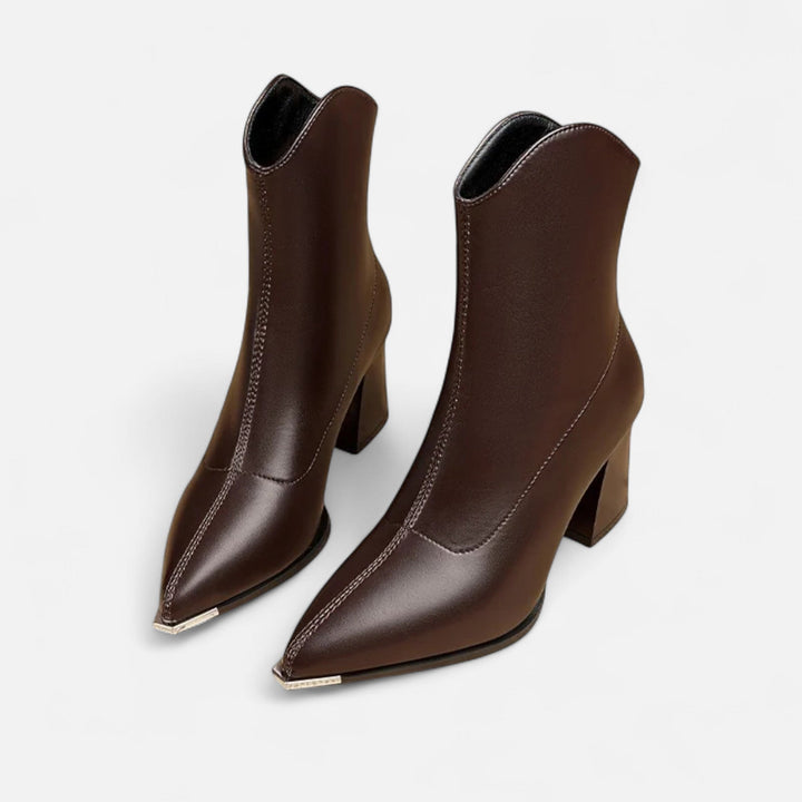 Stylish women's pointed-toe Chelsea boots with elastic side panels. Elegant ankle boots for modern wardrobes.