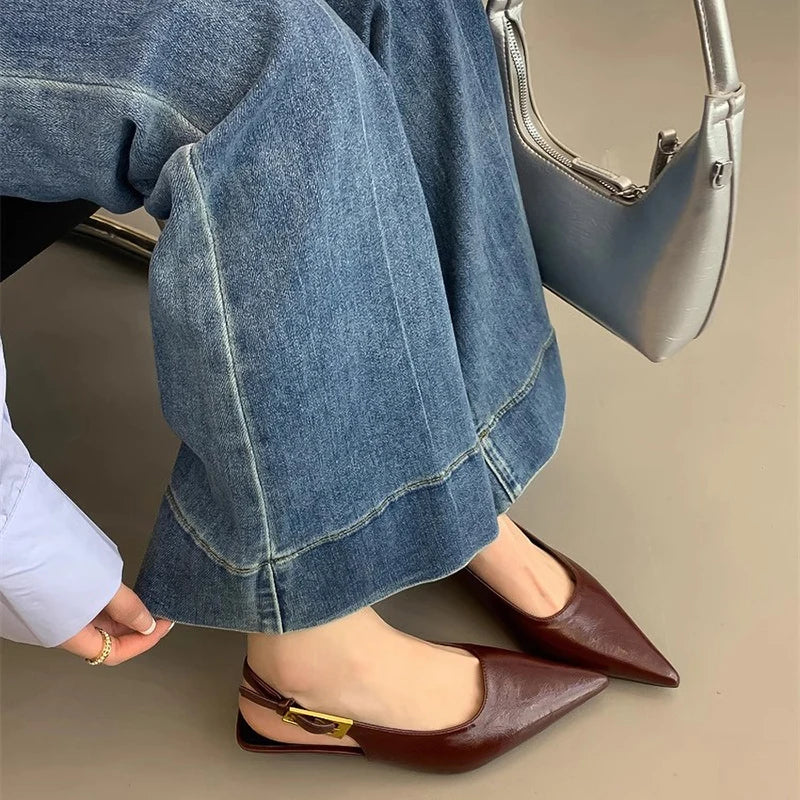 Elegant women's pointed toe slip-on mules with a low kitten heel, ideal for casual-elegant style.
