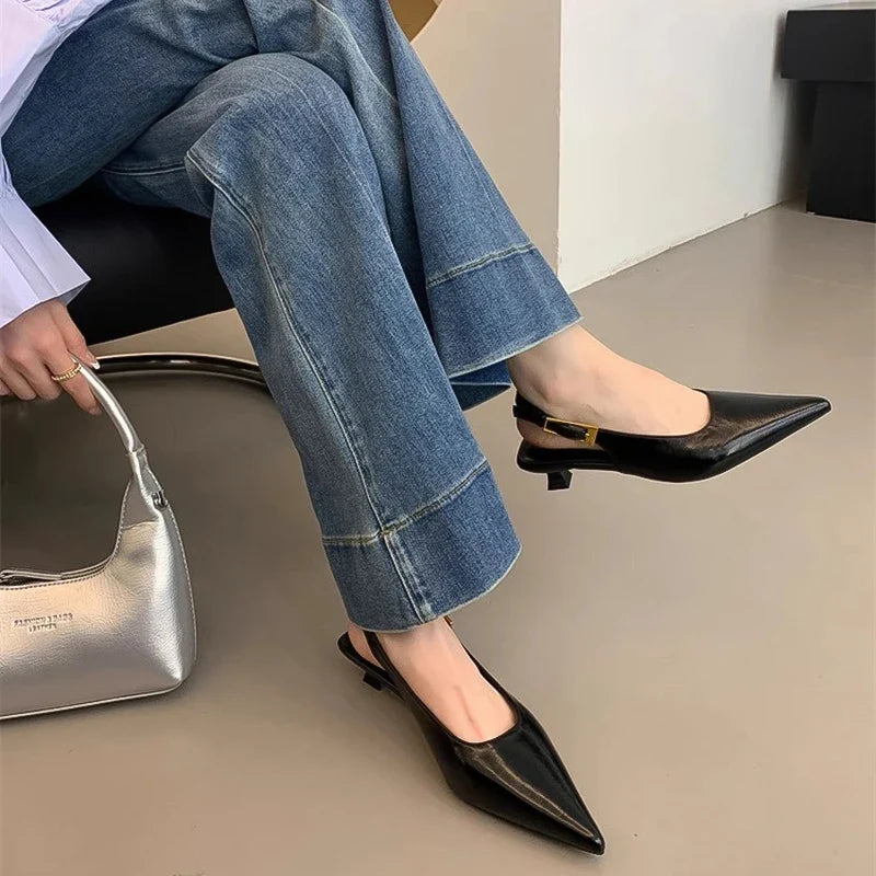 Side view of women's comfortable pointed toe kitten heel mules, versatile for office or evening.