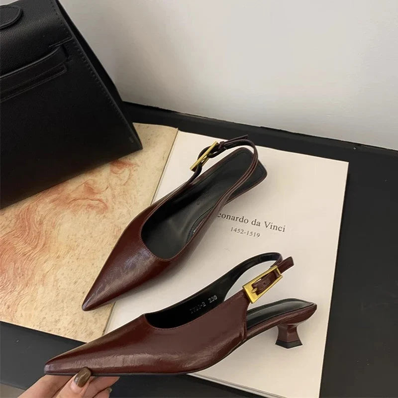 Fashionable women's pointed toe kitten heel mules, offering a blend of casual elegance and comfort.