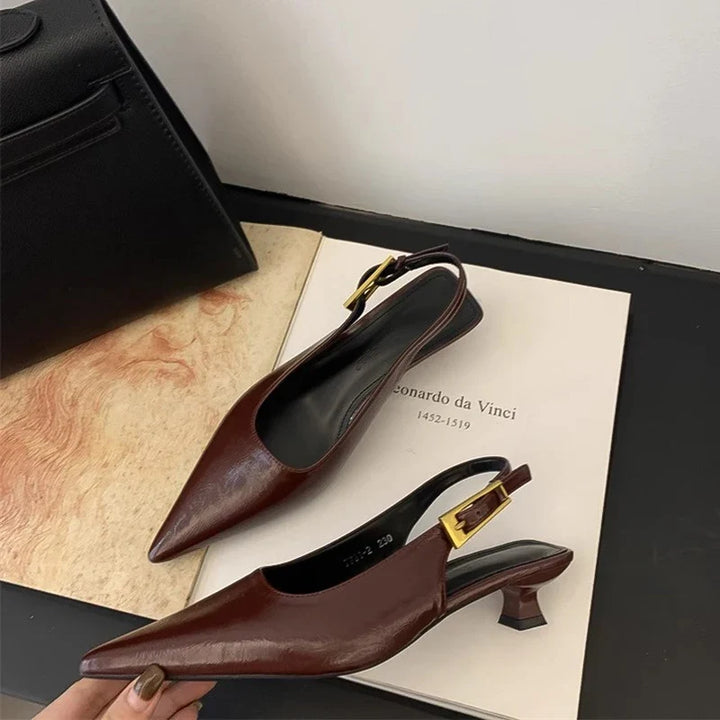 Fashionable women's pointed toe kitten heel mules, offering a blend of casual elegance and comfort.